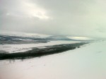 Day 99. Looking east down to Kilpisjarvi lake and the town beneath the distant crag