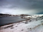 Day 125. Homesteads beside Vestertana fjord emerging from the winters snowfall