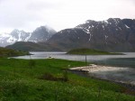 Day 166.2 One of the small sandy beaches with the dramatic brackdrop of impressive mountains Day 166.2 One of the small sandy beaches with the dramatic brackdrop of impressive mountains