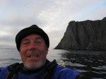 Day 159.6 A self portrait with Nordkapp in the background having rounded it at midnight