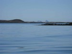 Day 190.5 Looking across some skerries in Sandvaer to the very steep Traena island with its 400 metre mountains