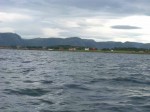 Day 200.1 The small lush island of Lauvoy in the foreground and the mountains between Frohavet and Stjornfjord behind