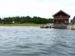 Day 203.1 The boathouse and farm at Sandvika bay on Lesundoya island