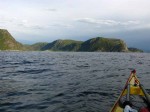 Day 211.7 Paddling down across the outside of Hoddervika bay with the southermost of the 3 western headlands called Furustavern and Furenes