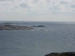 Day 238.1 The view from the top of Ryvingen Fyr lighthouse towards  the skerry of Pysen which is barely visible to the far right of the island with the cairn on it