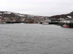 Day 140.2 a view across some of the harbour at Kiberg with one of the wharfs