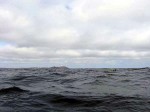 Day 141.2 Jon paddling ahead in the big swell towards Vardo